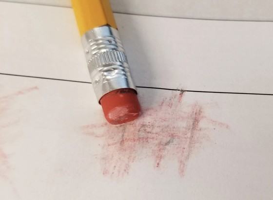 Eraser smudging a pencil mark
