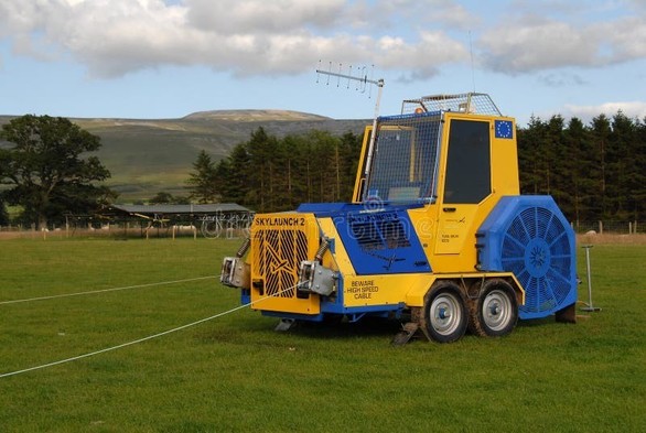 Yellow and blue winch in a field